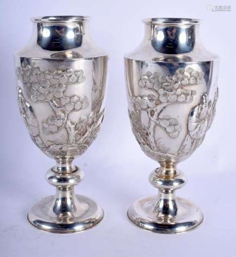 A PAIR OF 19TH CENTURY CHINESE EXPORT SILVER VASES