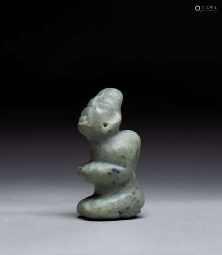 Petite statuette anthropomorphe sculptée d'un cham...