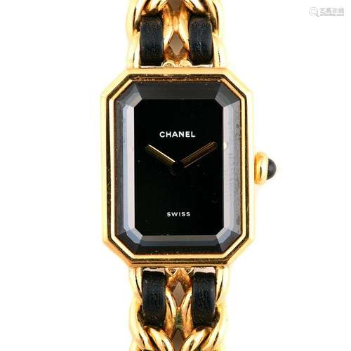 Ladies Chanel Black and Gold-Tone Fashion Wristwatch.