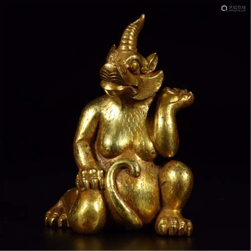 A CHINESE GILT BRONZE BEAST TABLE ITEM