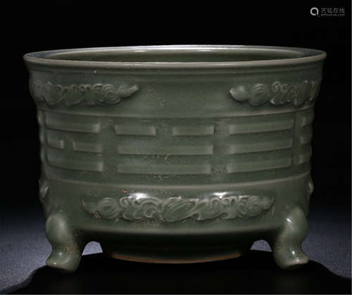 A CHINESE GREEN GLAZED CARVED TRIPLE FEET CENSER