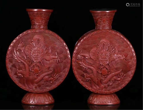 A PAIR OF CHINESE CINNABAR DRAGON FLAT VASES