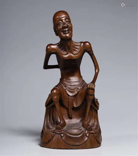 A CHINESE CARVED BOXWOOD SEATED LOHAN