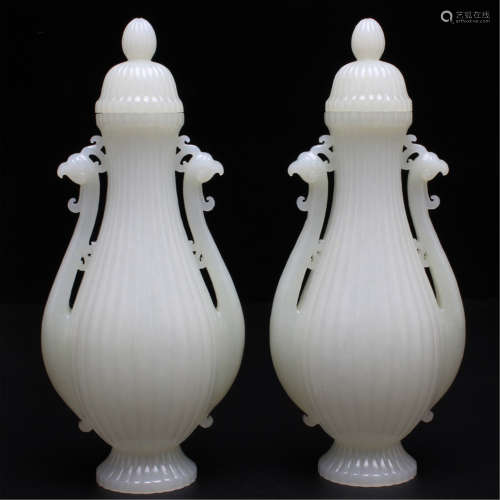 A PAIR OF CHINESE CARVED JADE BOTTLES