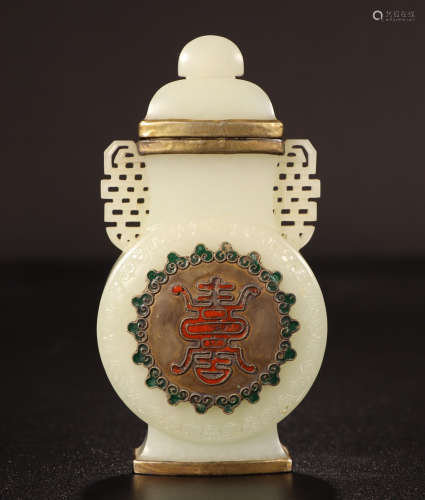 A CHINESE CARVED JADE LIDDED BOTTLE
