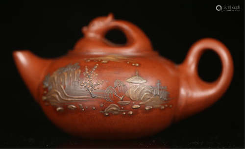 A CHINESE ZISHA CLAY MOUNTAIN VIEW TEA POT