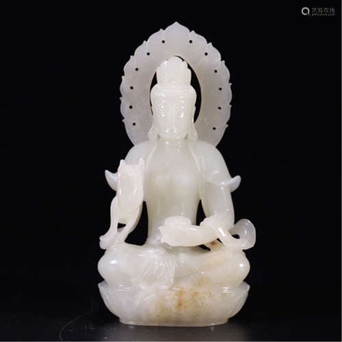 A CHINESE CARVED ANCIENT JADE SEATED GUANYIN