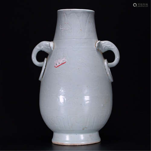 A CHINESE PORCELAIN CELADON GLAZED DRAGON HANDLE VASE