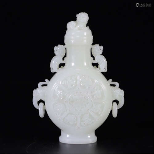 A CHINESE CARVED WHITE JADE LION HANDLE LIDDED BOTTLE