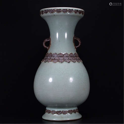 A CHINESE PORCELAIN CELADON GLAZED IRON FLOWER INLAID VASE