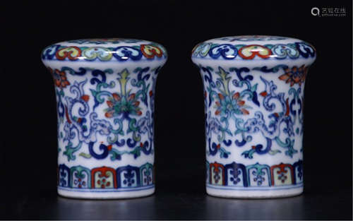 A PAIR OF CHINESE PORCELAIN DOUCAI FLOWER SCROLL HEAD