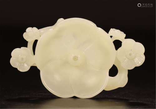 A CHINESE CARVED JADE FLOWER HOLDER