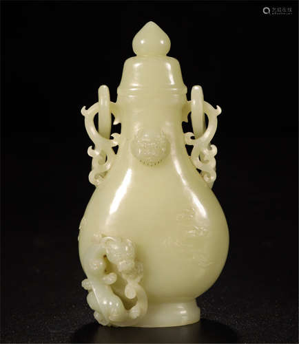 A CHINESE CARVED JADE DRAGON HANDLE LIDDED BOTTLE