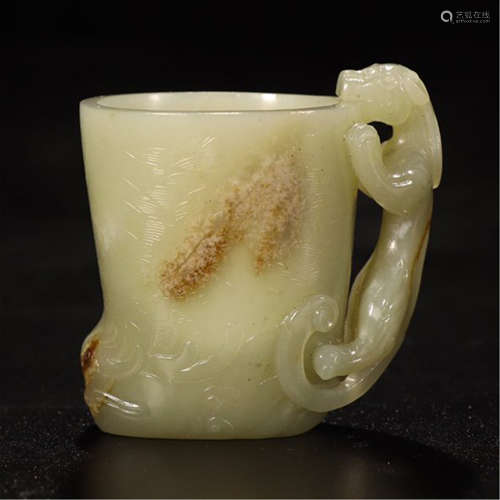 A CHINESE CARVED JADE DRAGON SINGLE HANDLE CUP