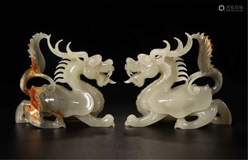 A PAIR OF CHINESE CARVED JADE DRAGON TABLE ITEMS