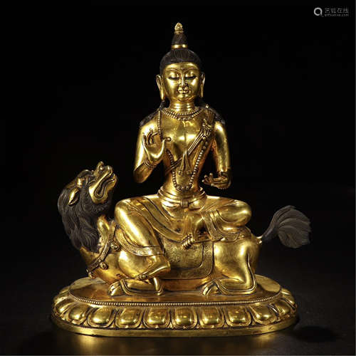 A CHINESE GILT BRONZE SEATED GUANYIN