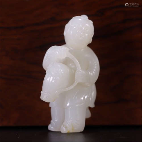 A CHINESE CARVED JADE BOY TABLE ITEM