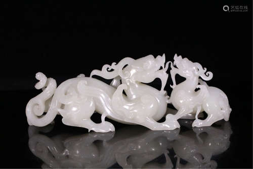 A CHINESE CARVED JADE BEAST MOTHER TABLE ITEM