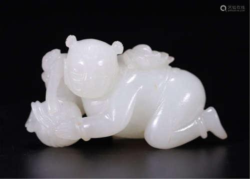 A CHINESE CARVED WHITE JADE BOY TABLE ITEM