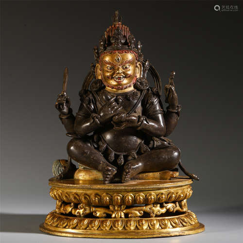 A CHINESE GILT BRONZE SEATED MAHAKALA