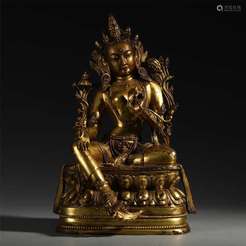 A CHINESE GILT BRONZE SEATED GUANYIN