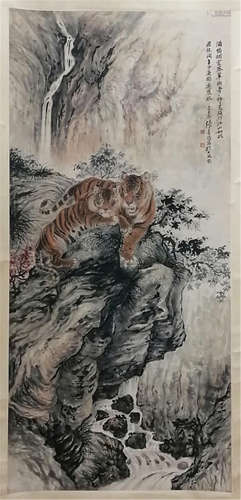 A CHINESE SCROLL PAINTING OF TIGER ON ROCK