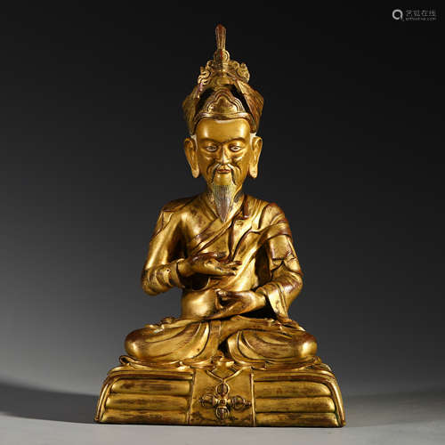 A CHINESE GILT BRONZE SEATED BUDDHA