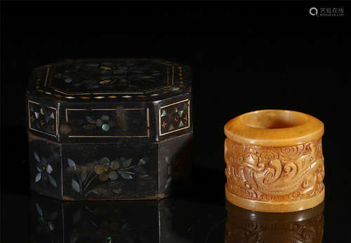 A CHINESE CARVED JADE RING WITH WOOD BOX