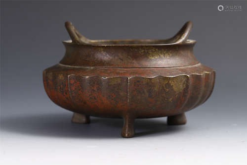 A CHINESE BRONZE HANDLE TRIPLE FEET INCENSE BURNER