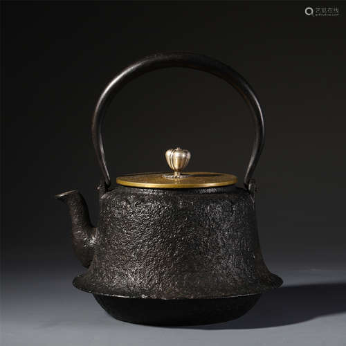 A CHINESE IRON LONG HANDLE KETTLE