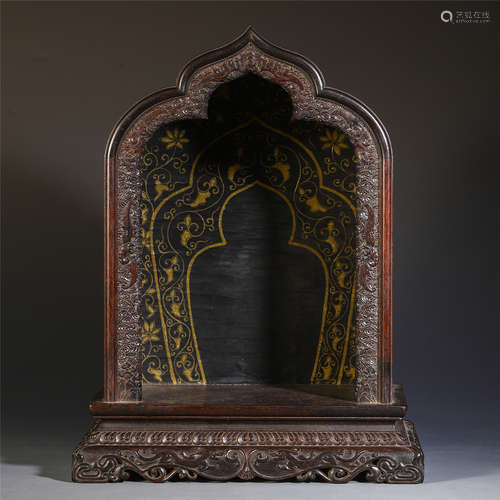 A CHINESE CARVED ZITAN WOOD PAINTED GOLD BUDDHIST NICHE