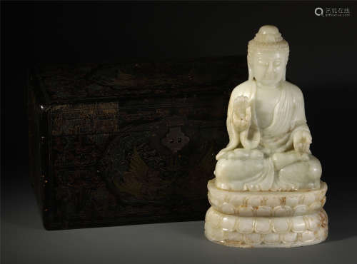 A CHINESE CARVED JADE SEATED GUANYIN