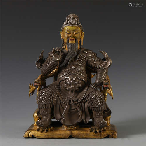 A CHINESE GILT SILVER SEATED WARRIOR