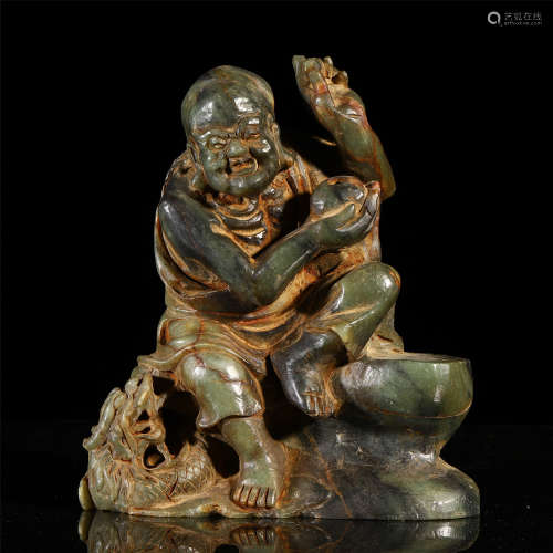 A CHINESE CARVED JADE SEATED BUDDHA