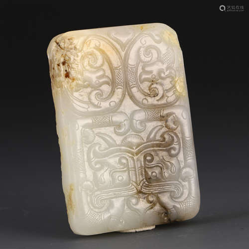 A CHINESE CARVED GAOGU JADE BEAST FACE PENDANT