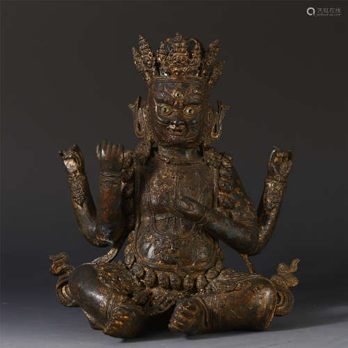 A CHINESE GOLD INLAID BRONZE FOUR ARMS SEATED BUDDHA