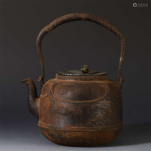 A CHINESE IRON LONG HANDLE KETTLE