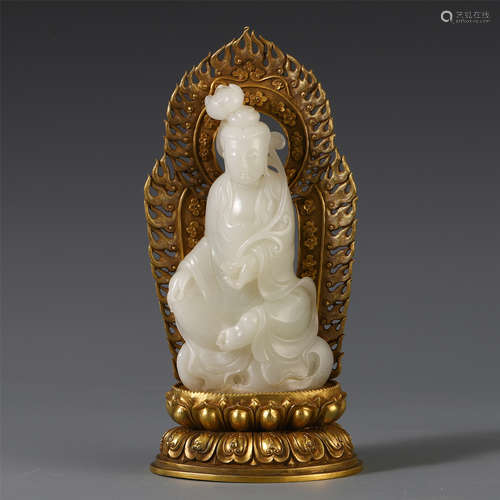 A CHINESE CARVED JADE SEATED GUANYIN WITH PURE GOLD BASE