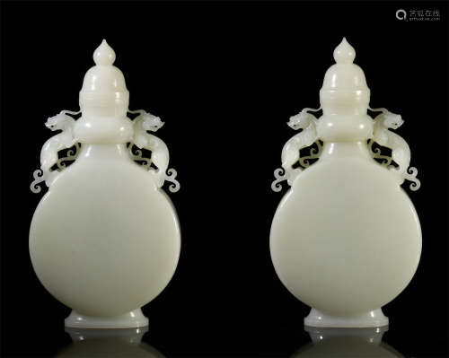 A PAIR OF CHINESE JADE DRAGON HANDLE LIDDED BOTTLE