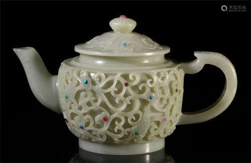 A CHINESE CARVED JADE TEA POT