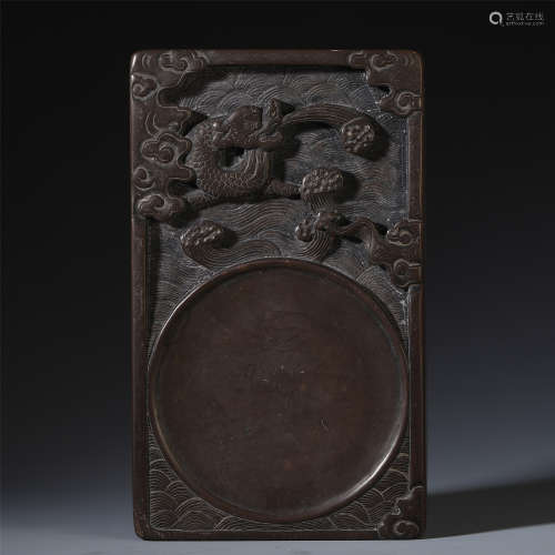 A CHINESE CARVED WOOD DRAGON INK STONE