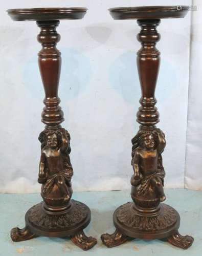 Pair of figural carved mahogany pedestals