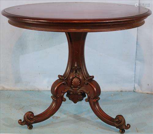 Walnut carved round parlor table attrib. to Roux