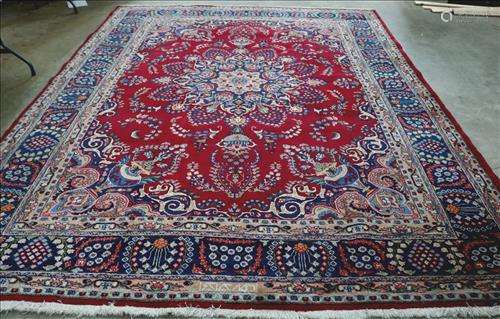 Hand made Persian rug, blue with red medallion, signed