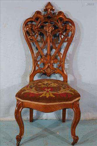 pierced carved walnut parlor chair with needlepoint
