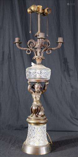 Cupid figural lamp with candle holders and cut glass