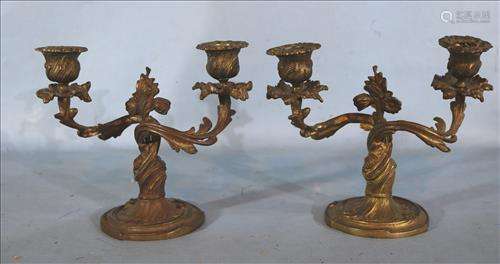 Pair of bronze candle holders, 7 in. T, 8 in. W.