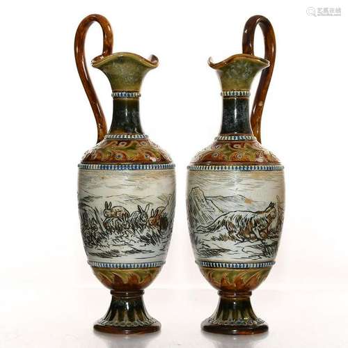 PAIR OF DOULTON LAMBETH HANNAH BARLOW STONEWARE EWERS