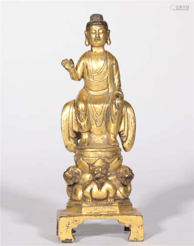 The sitting statue of the bronze-clad gold Buddha in the Tang Dynasty