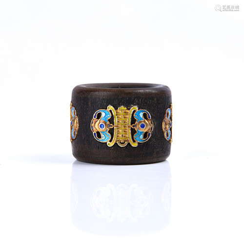 A Chinese Aloeswood Thumb Ring Inlaid with Gold and Gems